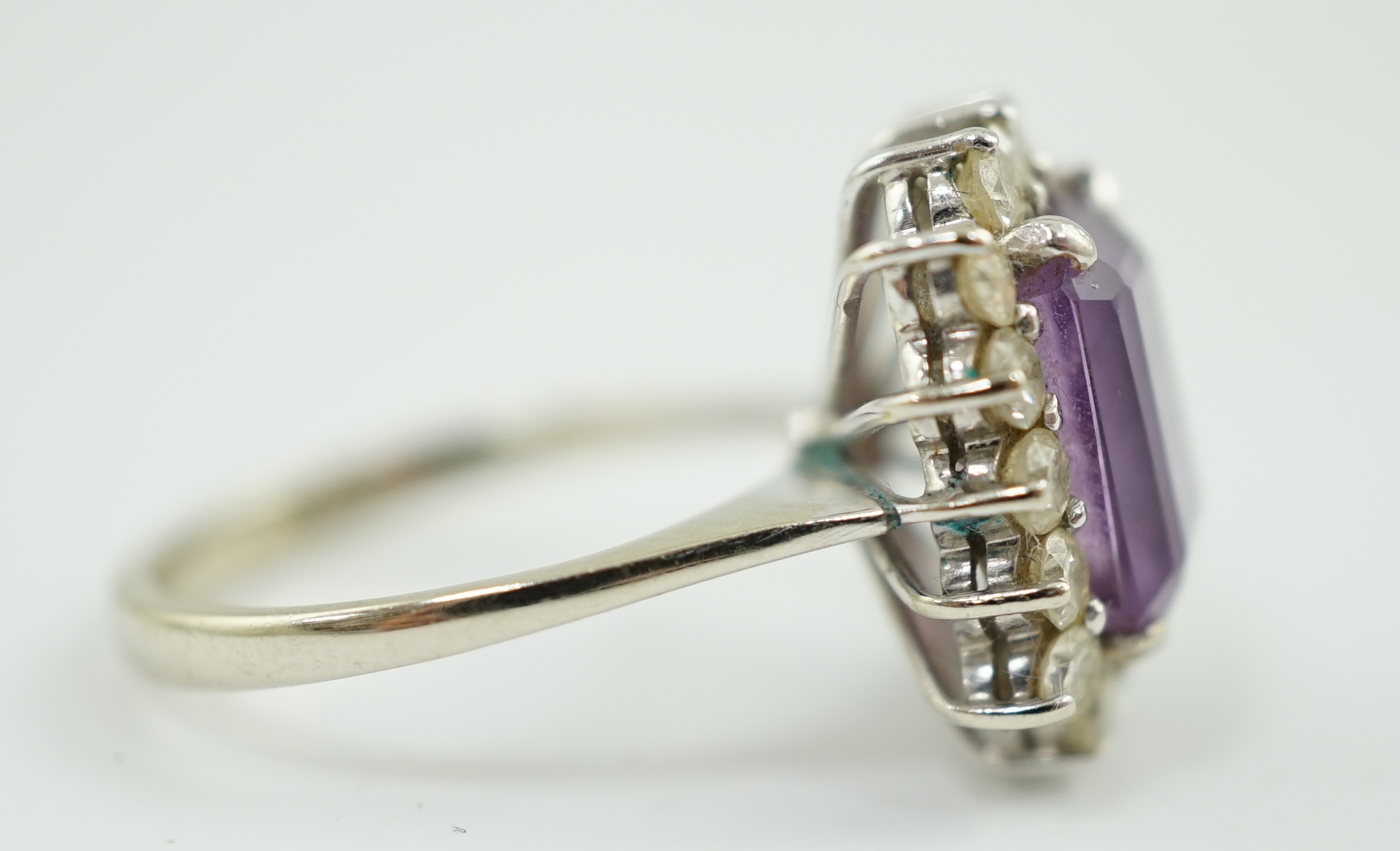 A modern white gold, amethyst and diamond set rectangular cluster ring